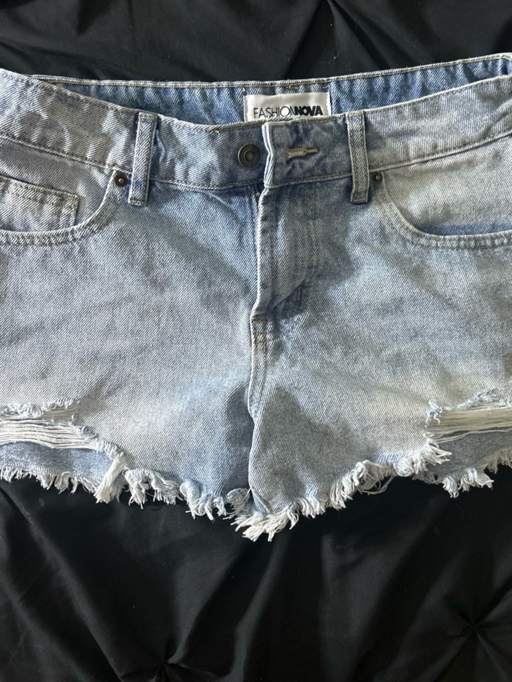 Light blue distressed denim shorts